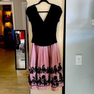 SL Fashions black top, mauve full skirt with black rosettes; size 10